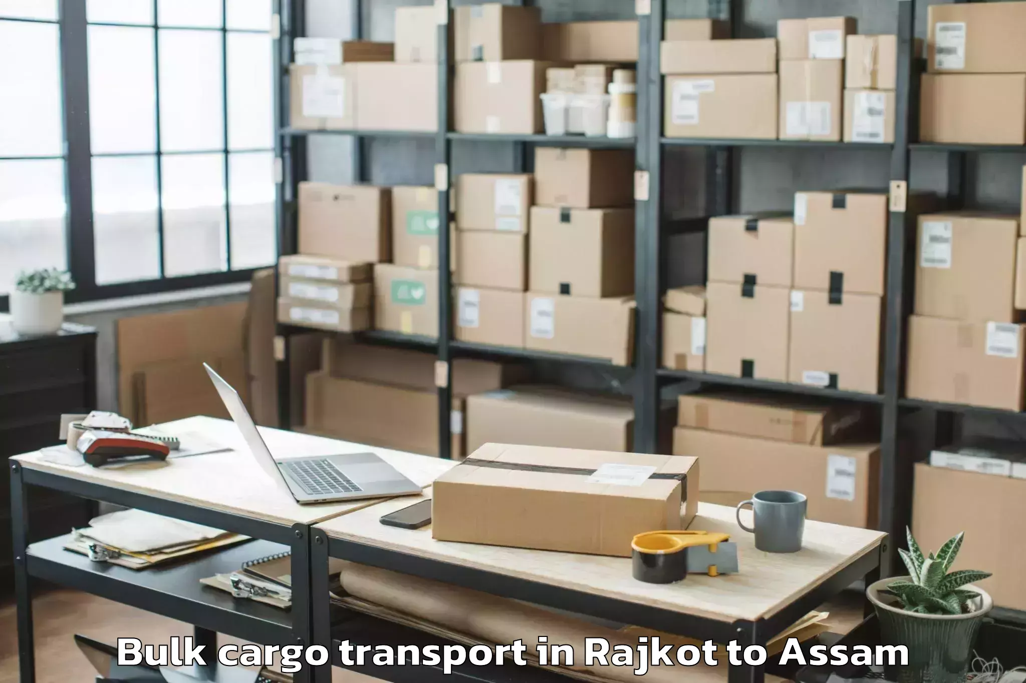 Reliable Rajkot to Udharbond Bulk Cargo Transport